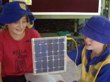 Children with a solar panel